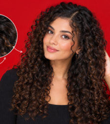 Woman with curly hair extensions blended into natural curls Woman with curly hair extensions blended into natural curls